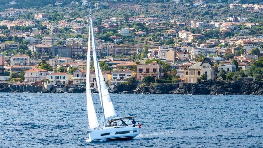 Catania: Sail Tour of Cyclops Coast with Sicilian Aperitif - Aci Trezza Cyclopean Isles stop: snorkeling, fish spotting, and SUP time
