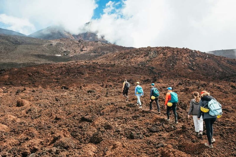 Mount Etna: Guided Trek 3,000 Meters to the Summit - What you actually get for your money: guide, poles, helmets, and Etna insurance