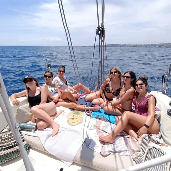 Sailboat Tour with Apertif in the islands of the cyclops - The Ulysses caves moment: lava pillows and water time together